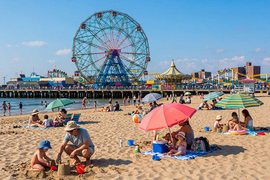 Coney Island beach and boardwalk on a sunny summer day with the Wonder Wheel
